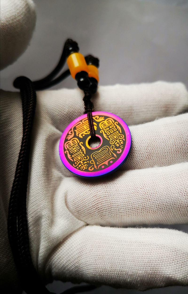 Titanium alloy charm coin with the inscription of Ziwei Hui