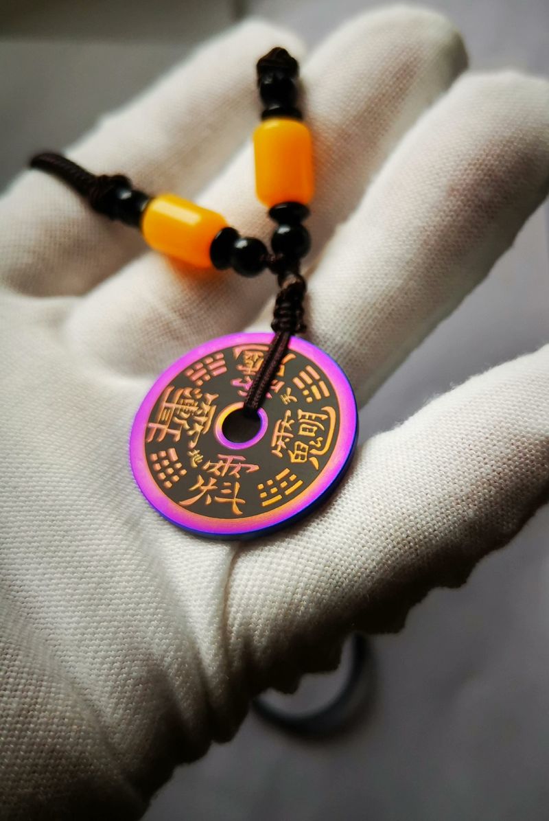 Titanium alloy charm coin with the inscription of Ziwei Hui