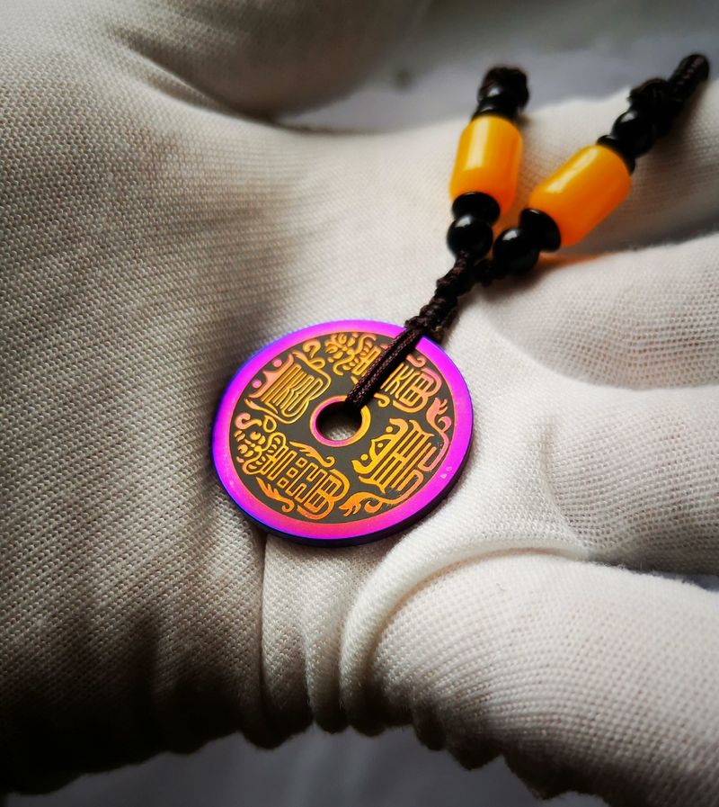 Titanium alloy charm coin with the inscription of Ziwei Hui