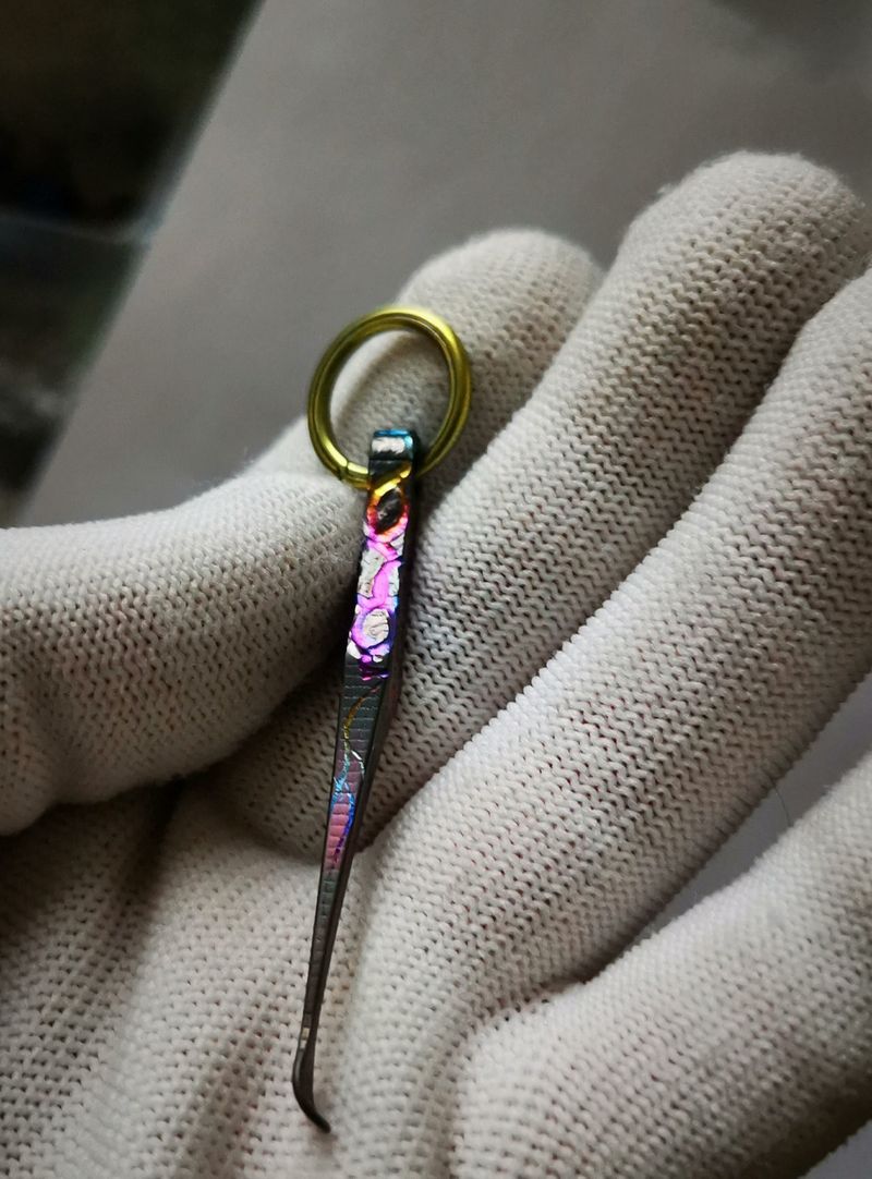 Small - sized buckle earpick made of titanium alloy