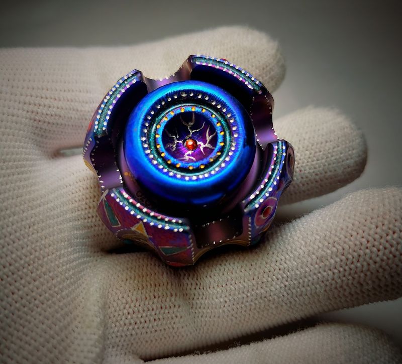 The iron - smith noise fidget spinner, titanium blue version